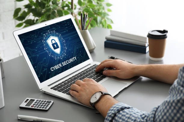 cyber security concept. man using application on laptop, closeup